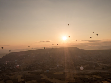Goreme, Turkey - September 16, 2016: Colorful hot air balloons flies on the sky above Cappadocia region.のeditorial素材