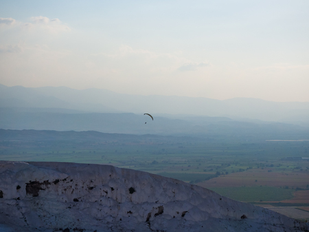Pamukkale, Denizli, Turkey - September 14, 2016: Palagliding over Pamukkale hills.のeditorial素材