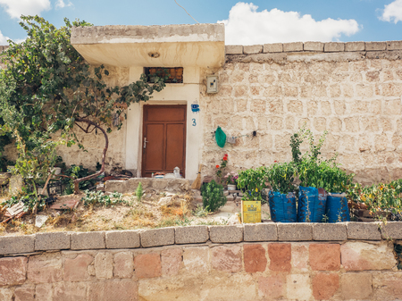 Ortahisar, Nevsehir, Turkey - September 16, 2016: Famouse stone house unique traditional architecture in Cappadocia.のeditorial素材