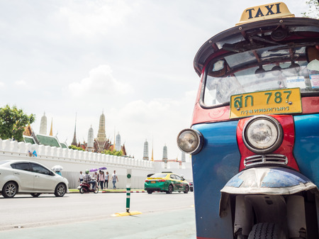 Bangkok, Thailand - July 20, 2016: Tuk Tuk taxi infront of the temple palace.のeditorial素材
