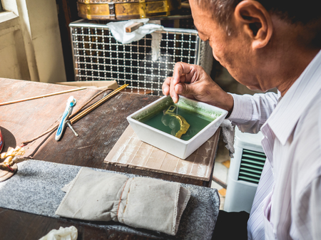 Bangkok, Thailand - August 30, 2016: Tradition gold cleaning workshop.のeditorial素材