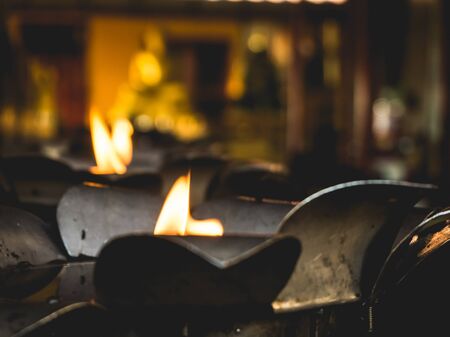 Oil lamp fire for lit the candle in the temple.