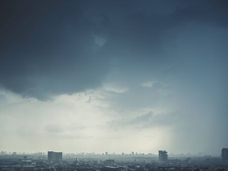 Stormy dark clouds over the city of Bangkok.の写真素材