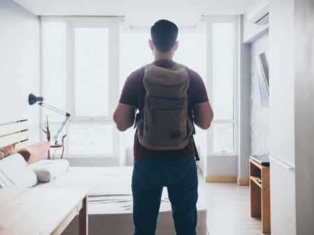 Asian man with backpack ready to travel and go adventure.の写真素材
