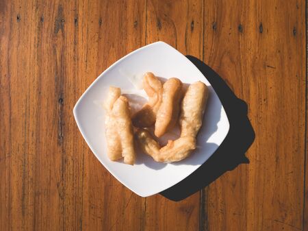 Patongko or deep fried dough stick and coffee Asian breakfast set.の写真素材