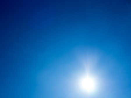 Blue vivid sky with smooth faded cloud.の写真素材