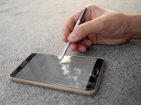 Bangkok, Thailand - December 7, 2016: Using Samsung Galaxy Note 5 with S pen.のeditorial素材