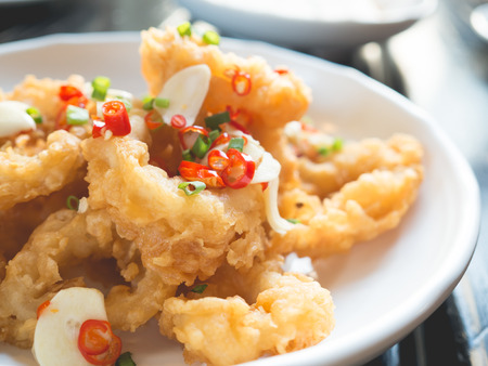 Spicy onion rings with fresh garlic and chilli.の写真素材
