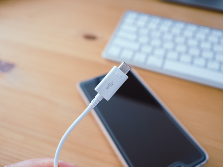 Close up of smartphone charger cable with usb plug.の写真素材
