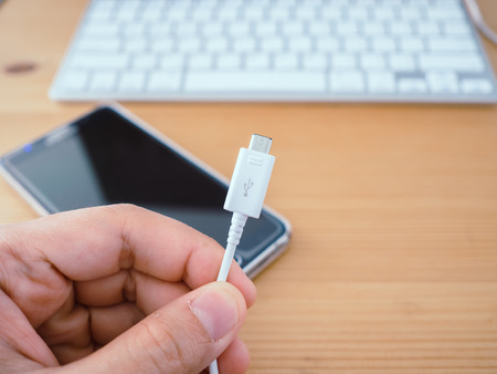 Close up of smartphone charger cable with usb plug.の写真素材