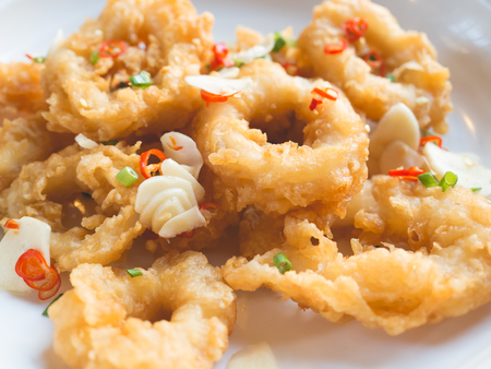 Spicy onion rings with fresh garlic and chilli.の写真素材