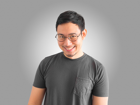 Happy and success Asian man with smiling face wears eyeglasses.の写真素材