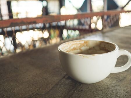 White coffee cup of worker on table in factory.の写真素材