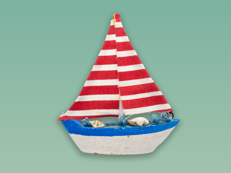 White boat model isolated on colour background.の写真素材