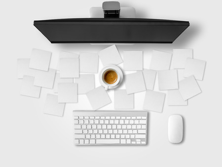 Busy office desk with a lot of note papers of work.の写真素材