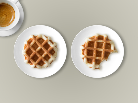 Breakfast and break time set of two waffles and one cup of coffee.の写真素材