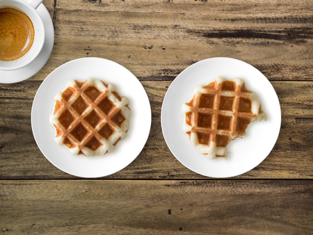 Breakfast and break time set of two waffles and one cup of coffee.の写真素材