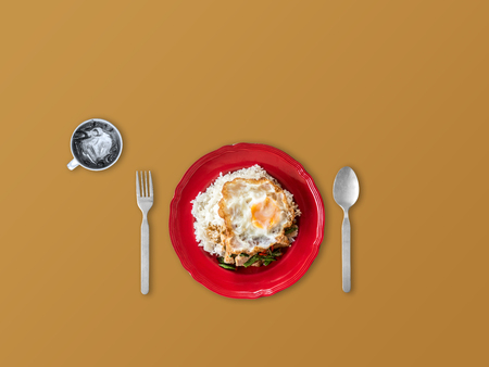 Rice topped with stir-fried pork and basil with fried egg lunch set.の写真素材