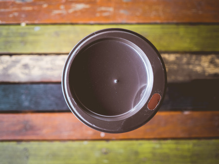 Hot instant coffee cup on vintage wooden table.の写真素材