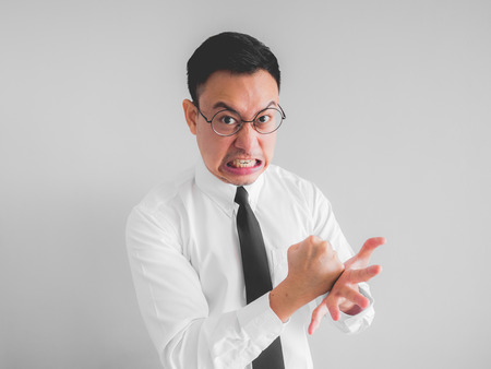 Angry Asian employee businessman in office uniform.の写真素材