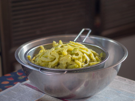 Boiled bitter melon in the metal bowl.