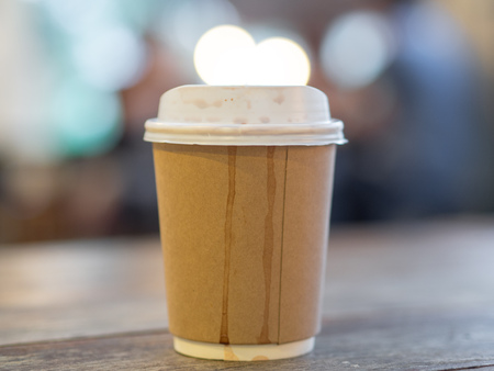 Paper cup of hot coffee in the cafe.の写真素材