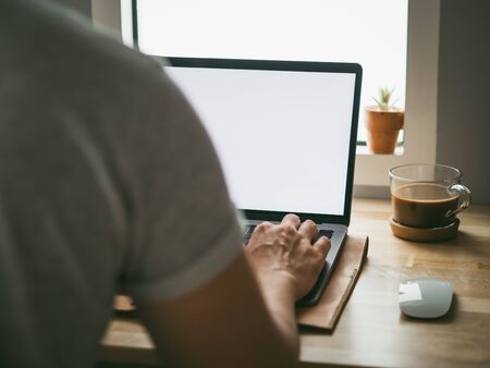Shoulder angle of Asian man using laptop computer.の写真素材