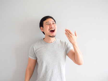 Asian man is feeling happy with his mouth breath and blowing.の写真素材