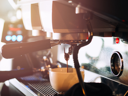 Process of making hot coffee from coffee machine.の写真素材