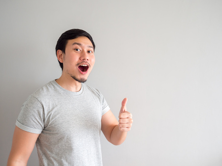 Asian man is feeling happy with his mouth breath and blowing.の写真素材