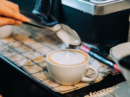 Process of making Latte coffee in the coffee workshop.の写真素材