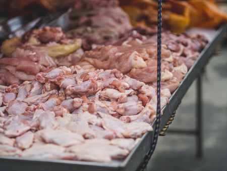 Various fresh meat of chicken and pork sell in local Thai fresh market.の写真素材