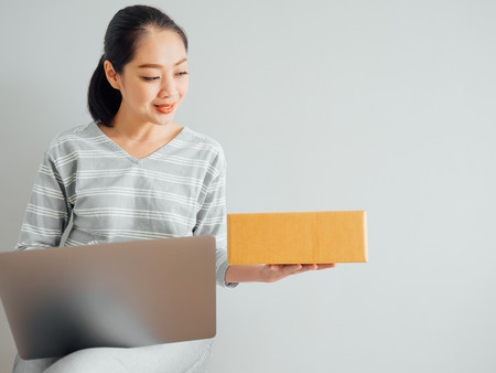 Concept of Asian woman happy with her online business sale.の写真素材