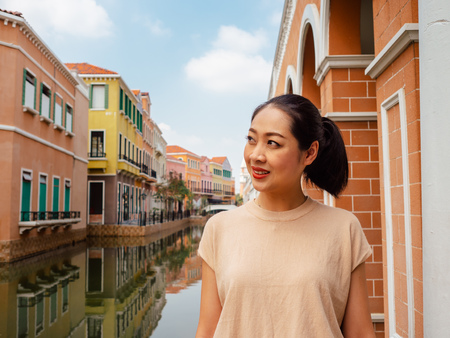 Smile Asian woman is standing outdoor in the summer.の写真素材