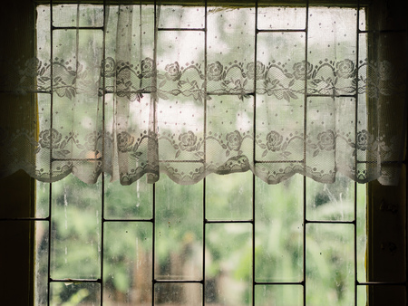 Vintage white curtains on soft light window in peaceful the morning.の写真素材