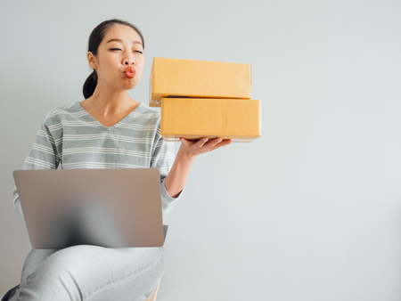 Concept of Asian woman happy with her online business sale.の写真素材