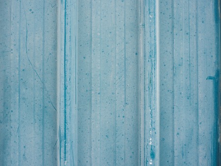 Blue cheap zinc fence background.の写真素材