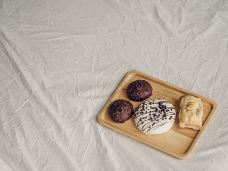 Set of chocolate doughnuts and pie.