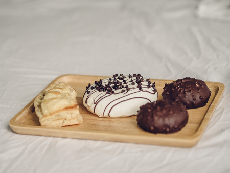 Set of chocolate doughnuts and pie.