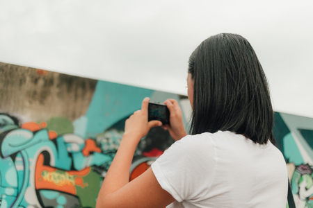 Asian woman enjoy taking photo of an unknown abandoned building.の写真素材