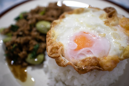 Closeup Kao Pad Kra Prao or Thai rice with pork and basil.