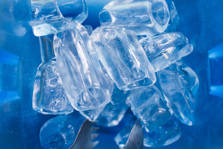 Ice cube in blue plastic basket. Thai local restaurant serving style.の写真素材