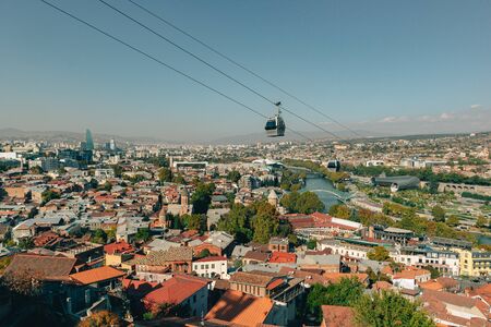 Cityscape view from mountain of Tbilisi old town with cable car on the sky in Georgia.の写真素材