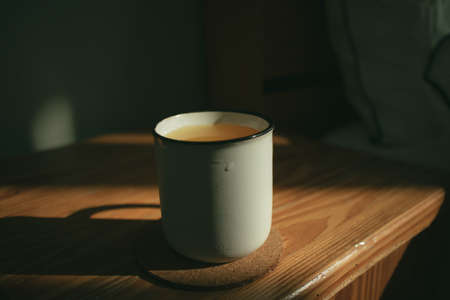 Fresh orange drink on wooden tea table in the morning.の写真素材