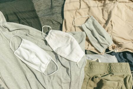 A group of clothes on a bed. High quality photoの写真素材