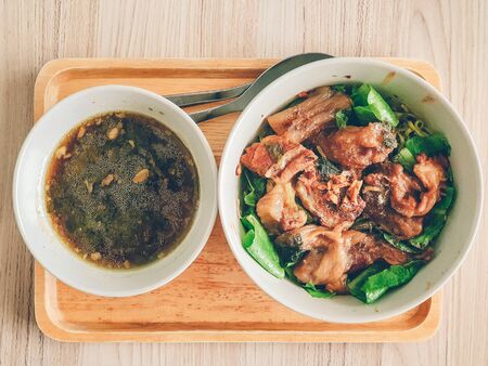 Homemade simple and easy noodle served on wooden plate in concept of stay at home.の写真素材