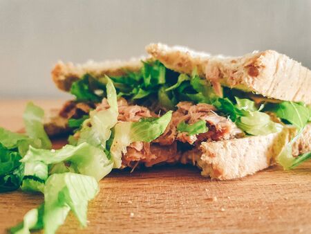 Homemade simple sandwiches served on wooden table. Concept of easy and fast meal.