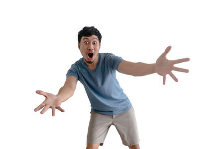 Asian man with surprised action pose on isolated background.の写真素材