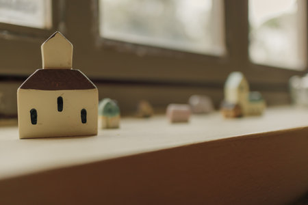 Tiny simple resin houses decorated on the edge of windows.の写真素材
