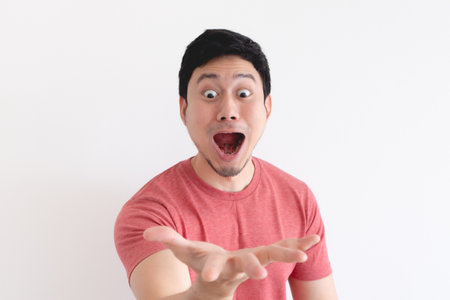 Wow and shocked face of funny Asian man isolated on white background.